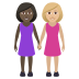 👩🏿‍🤝‍👩🏼 women holding hands: dark skin tone, medium-light skin tone display on JoyPixels